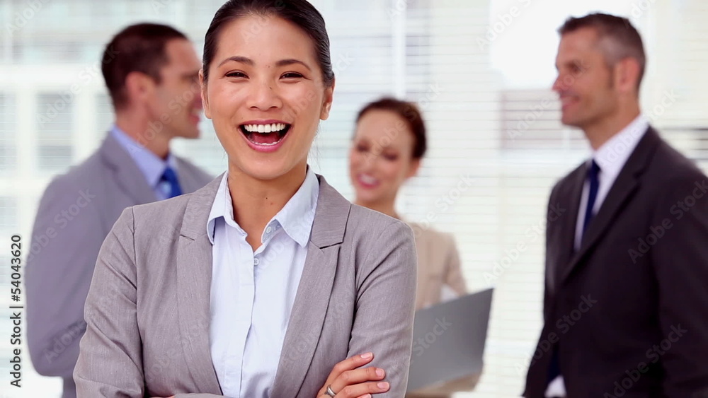 Businesswoman laughing and looking at camera Businesswoman laughing and looking at camera