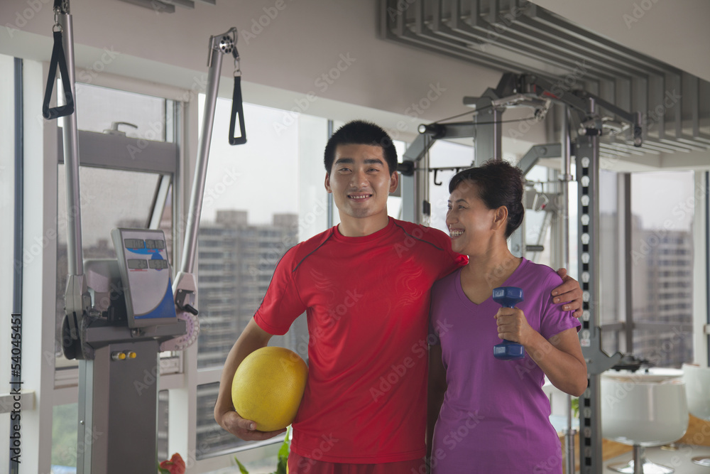 Mature women with her trainer after working out Mature women with her trainer after working out