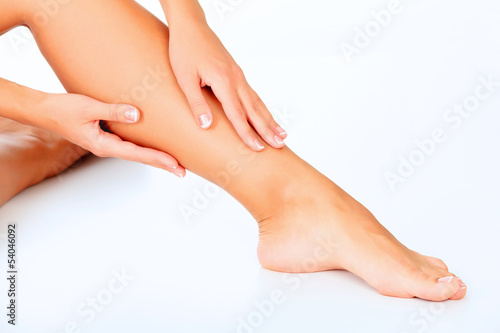 Female legs and hands, white background