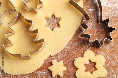 Pastry for Christmas cookies and cookie cutters.