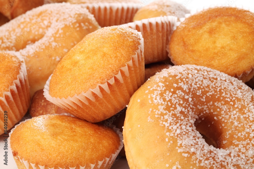 Lemon cupcakes and donuts close-up.