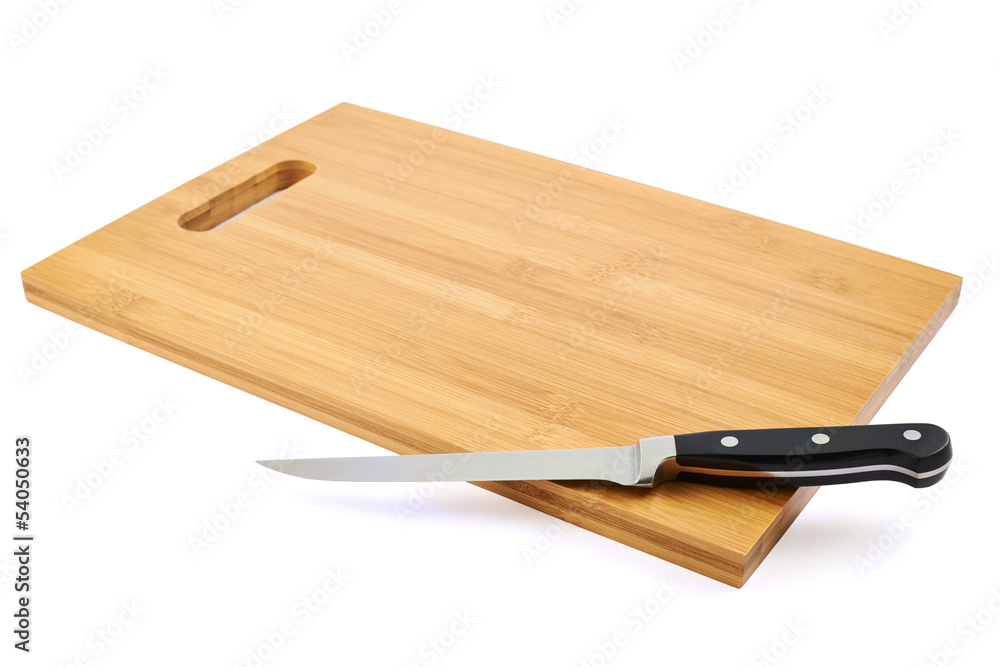 Steel kitchen knife on cutting board
