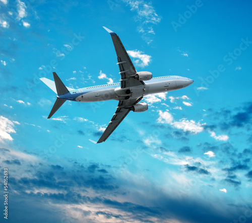 Big jet plane flying against perfect sky background