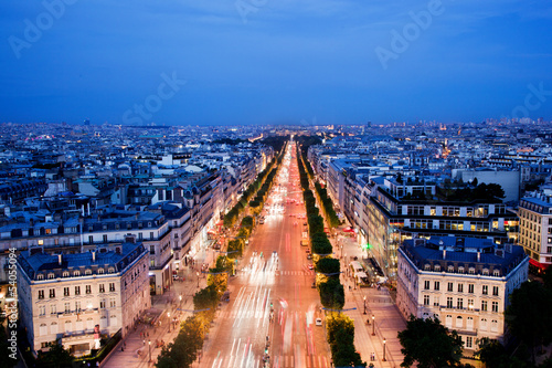 Avenue des Champs-Elysees in Paris, France at night