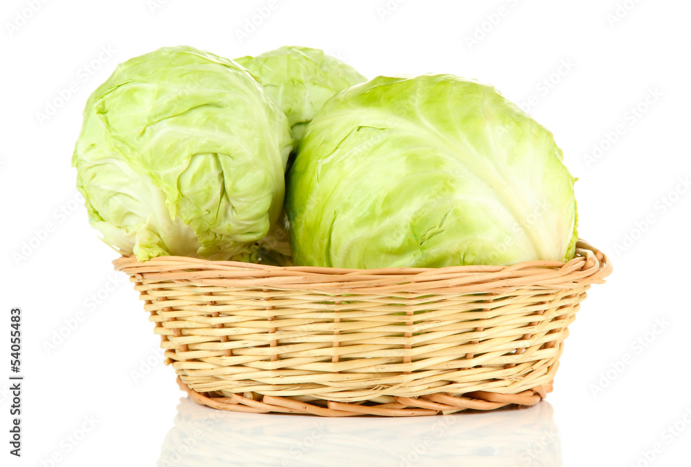 Fototapeta premium Green cabbage in wicker basket, isolated on white