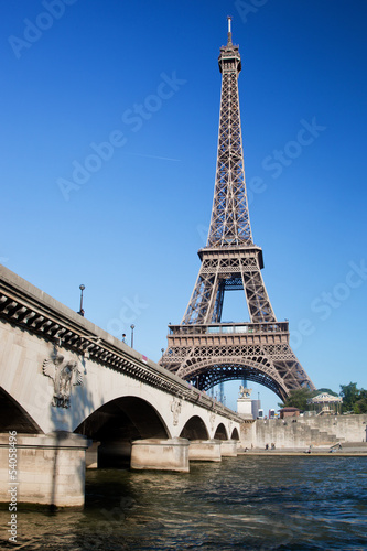 Eiffel Tower and bridge on Seine river in Paris, France.