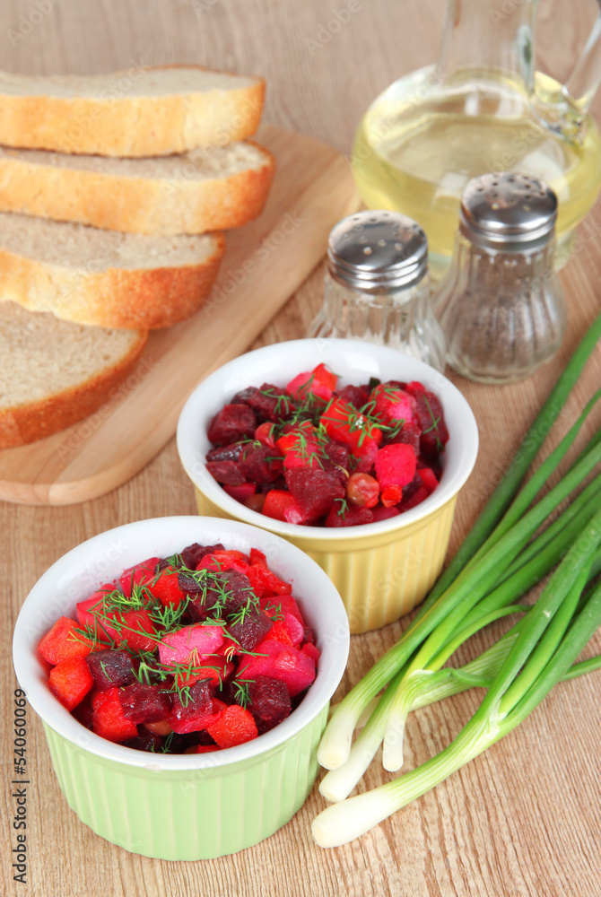 Beet salad in bowls on table close-up Beet salad in bowls on table close-up