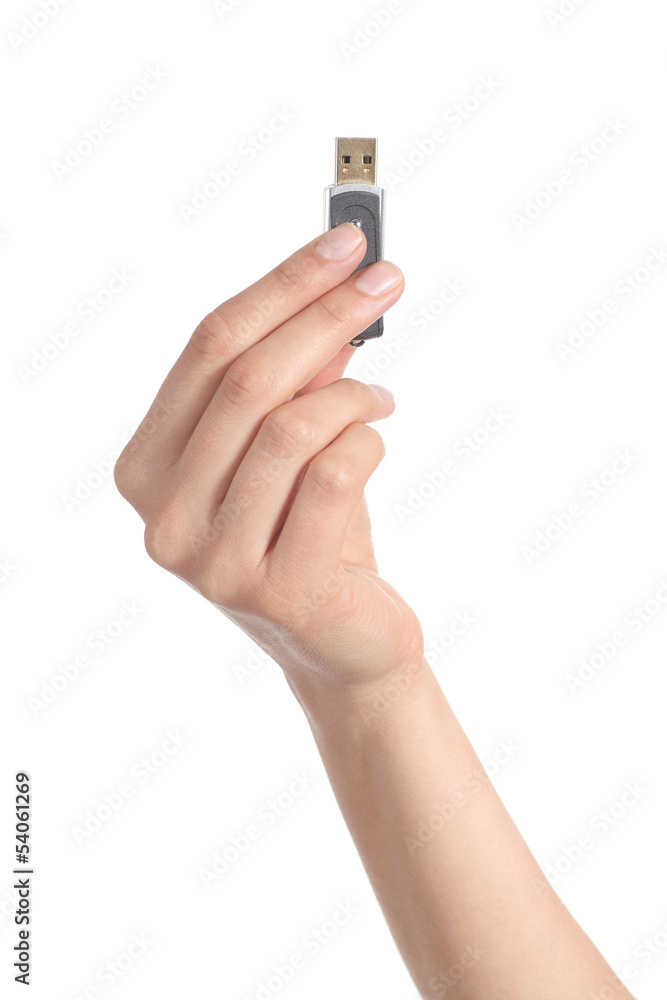 Woman hand holding up a flash drive Woman hand holding up a flash drive