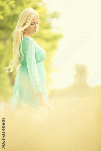 Young blond woman in the field