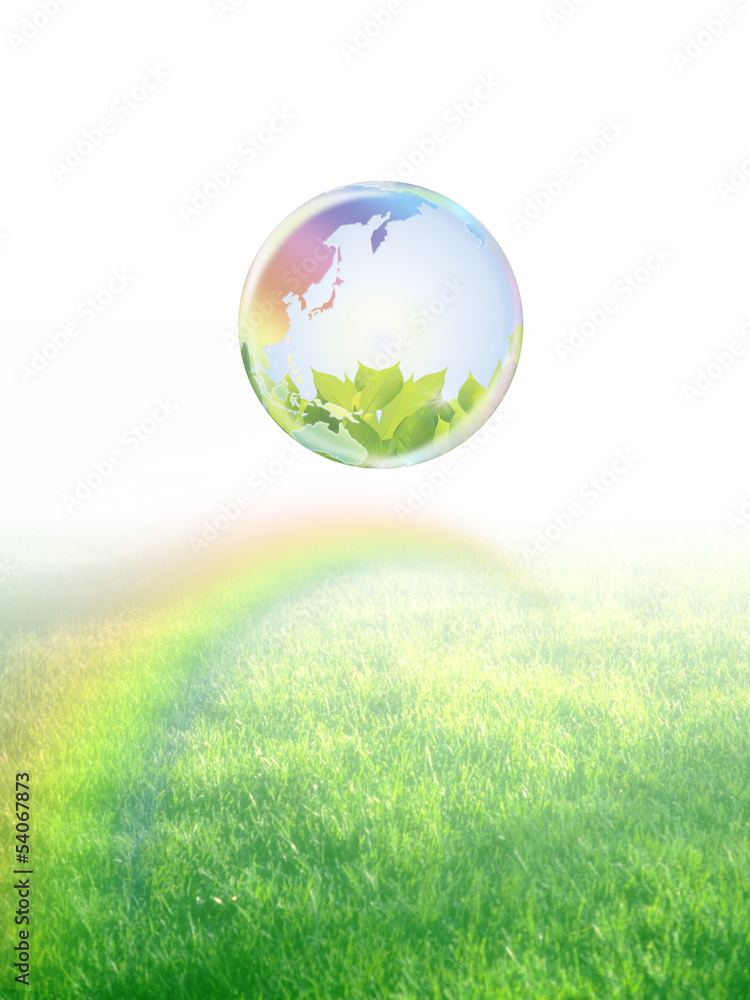 地球エコイメージ　虹のかかる草原に浮かぶ虹色の地球