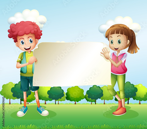 A boy and a girl holding a banner