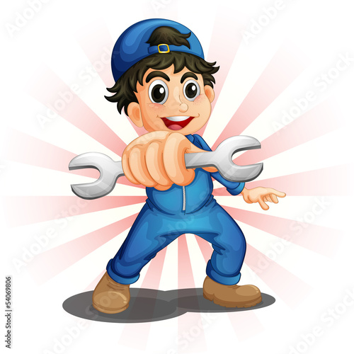 A male mechanic holding a wrench