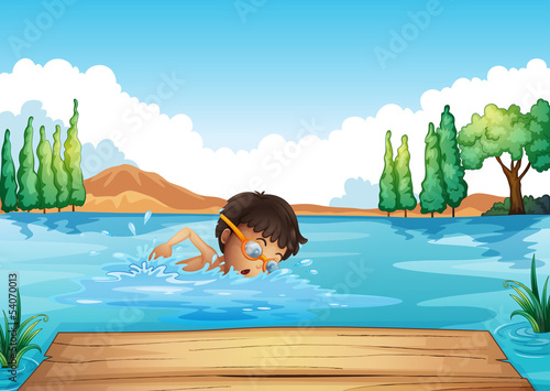 A young man swimming in the river