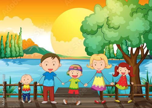 A happy family at the wooden bridge