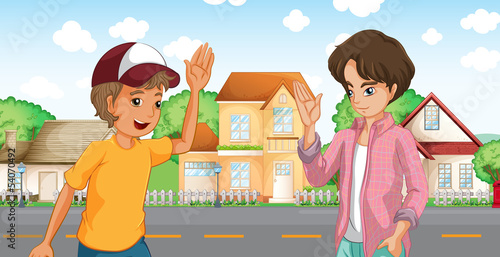 Two boys meeting across the big houses at the road