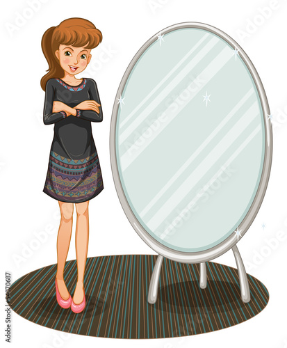 A woman beside a mirror