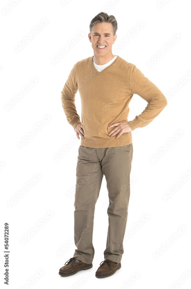 Portrait Of Happy Man Standing With Hand On Hips