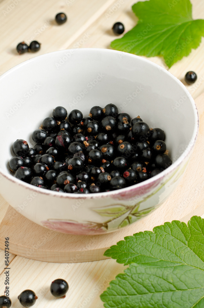 Black currants ripe and natural in a bowl Black currants ripe and natural in a bowl