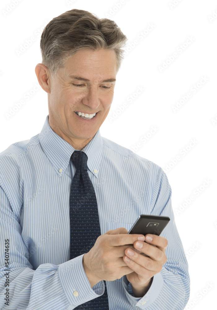 Happy Businessman Texting Through Smart Phone Happy Businessman Texting Through Smart Phone