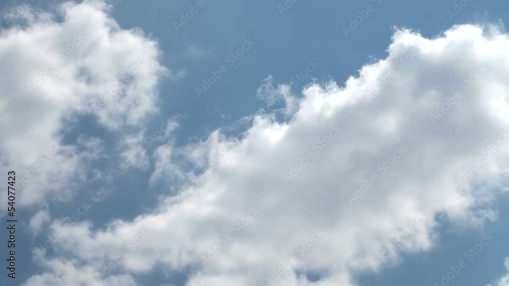 Time lapse clip of white fluffy clouds over blue sky Time lapse clip of white fluffy clouds over blue sky