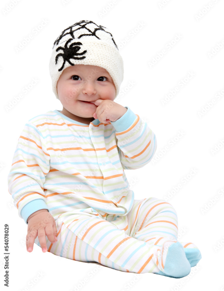 beautiful baby boy with knitted hat sitting beautiful baby boy with knitted hat sitting