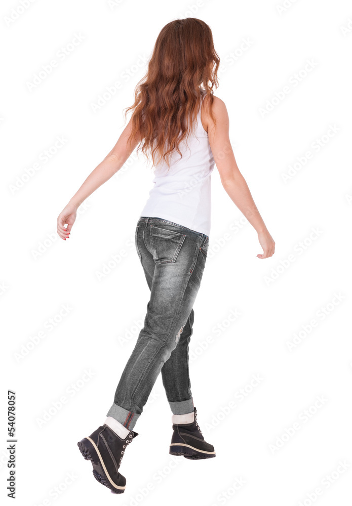 back view of jumping woman in jeans. back view of jumping woman in jeans.