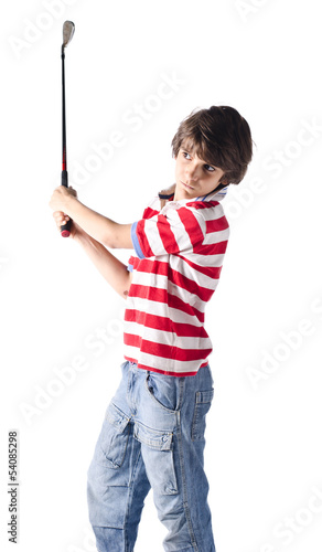 Child using golf club standing on white
