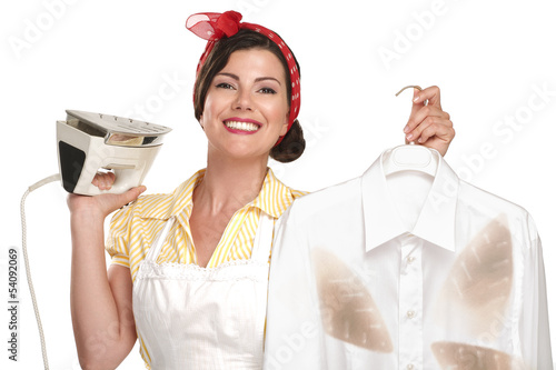 Fototapeta happy beautiful woman housewife ironing a shirt
