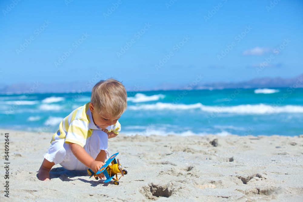 Boy playing with a toy airplane Boy playing with a toy airplane