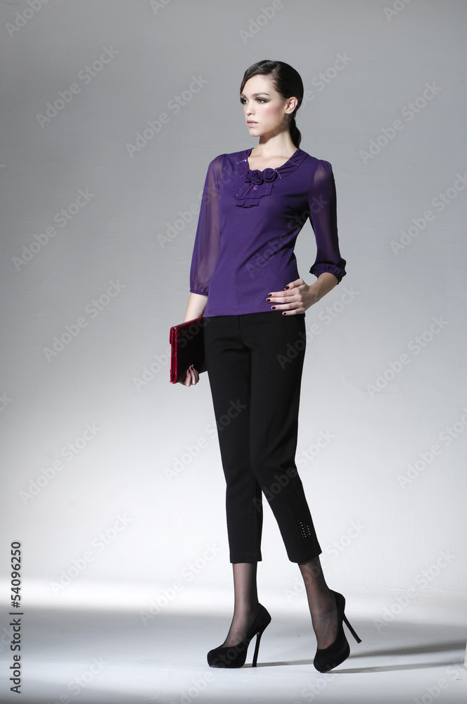 Full portrait of young beautiful woman with purse posing Full portrait of young beautiful woman with purse posing