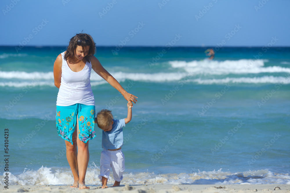 Fototapeta premium Mother and son on the beach