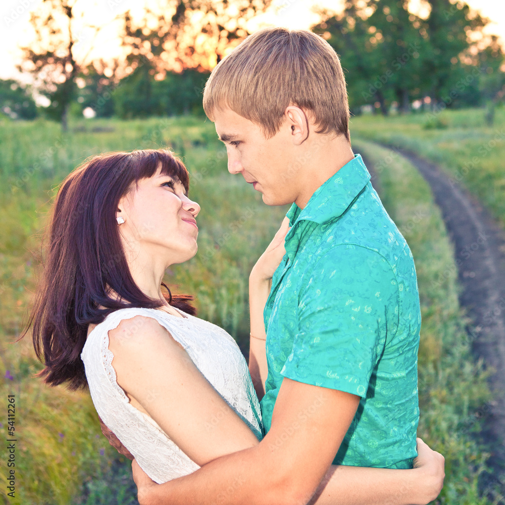 Young beautiful couple at sunset Young beautiful couple at sunset