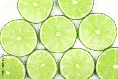 lime slices neatly arranged on a white background