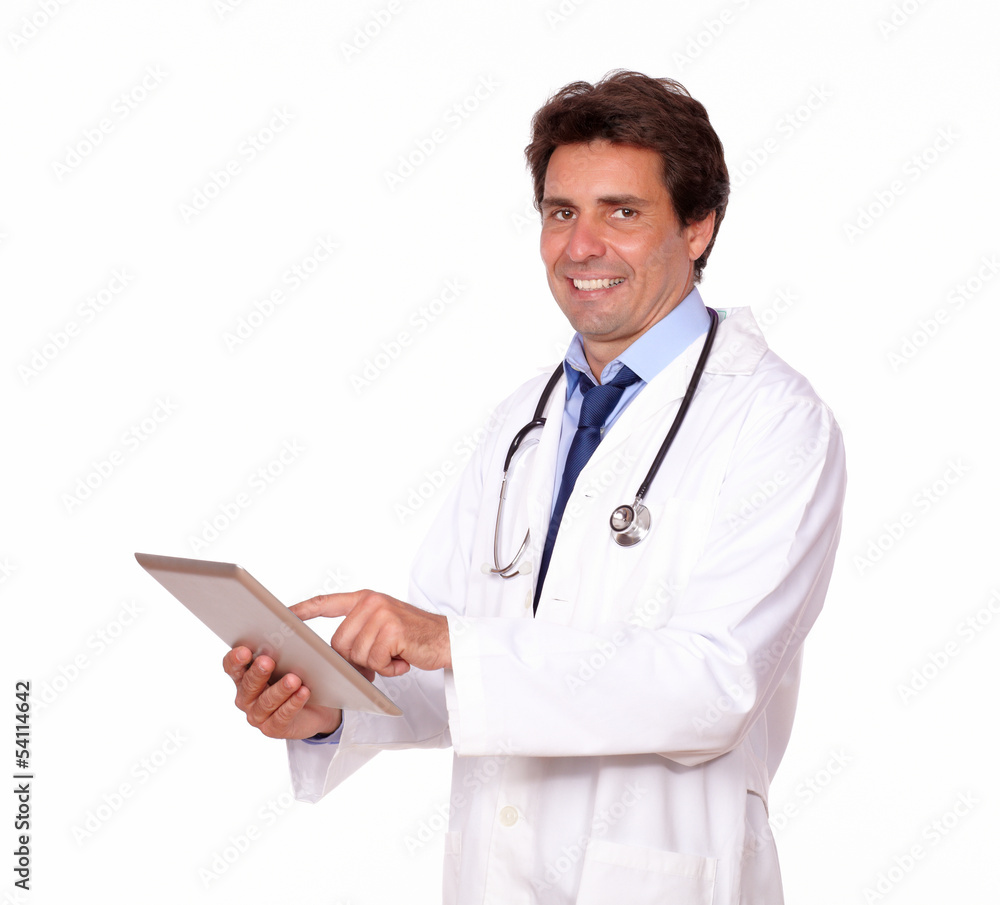 Smiling male doctor working on tablet pc Smiling male doctor working on tablet pc