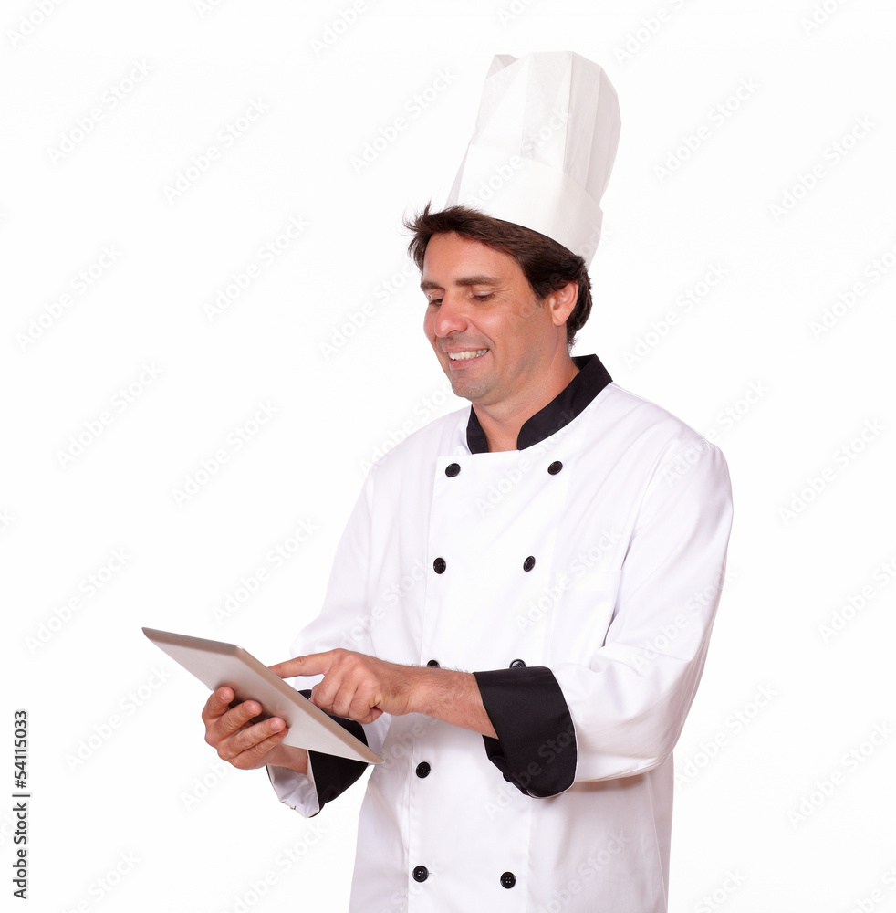 Professional chef working on tablet pc Professional chef working on tablet pc