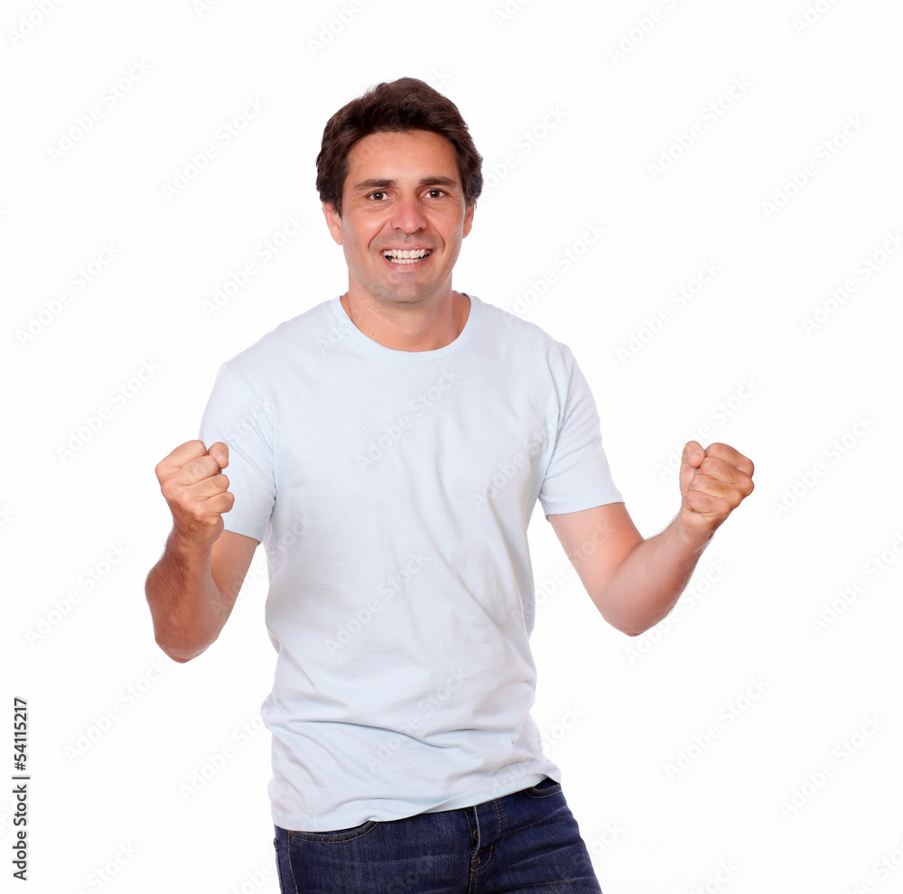 Cheerful male celebrating victory while standing Cheerful male celebrating victory while standing