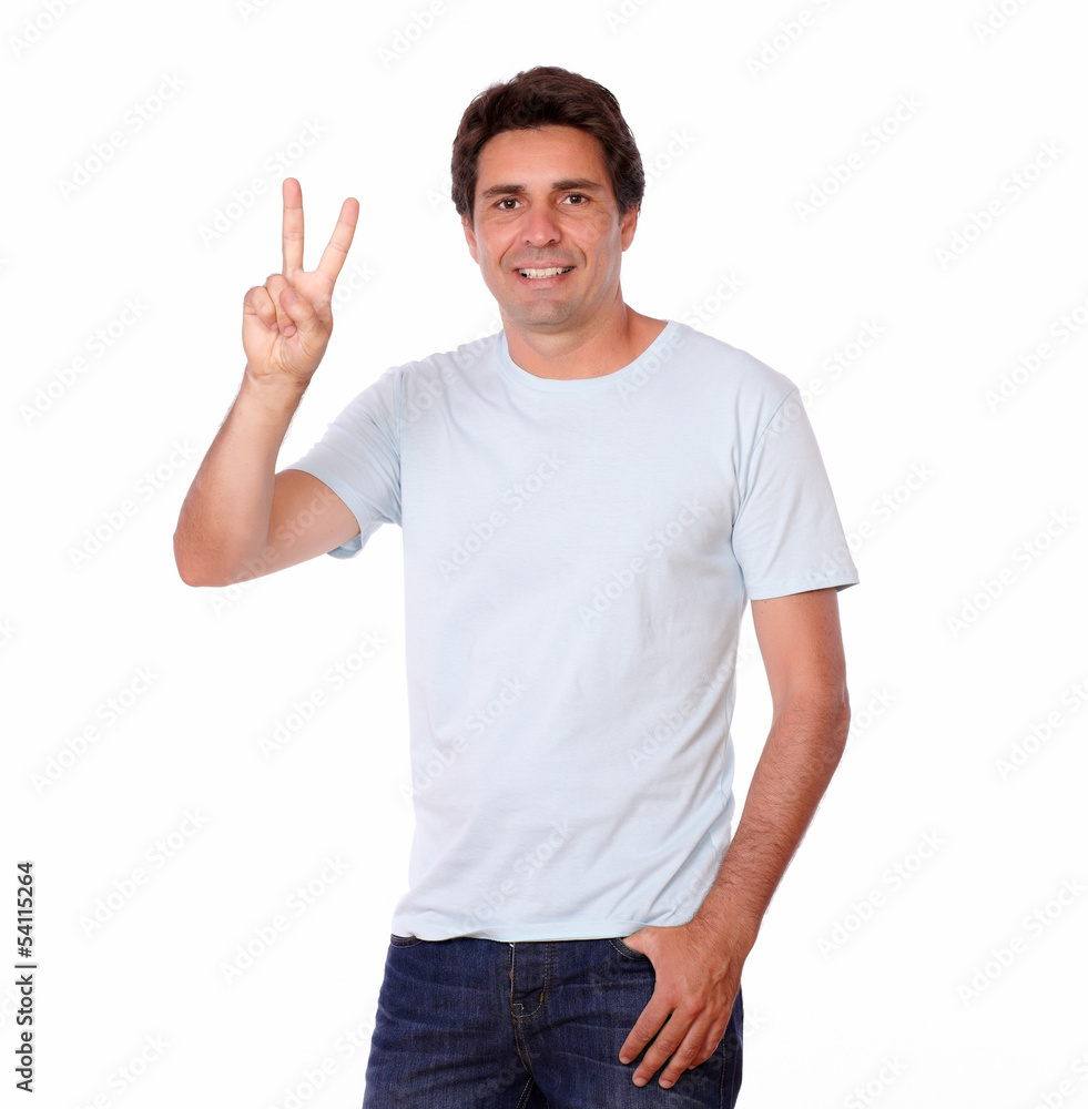 Handsome man showing victory sign with fingers Handsome man showing victory sign with fingers