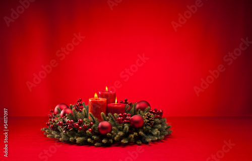 Red advent wreath with candles