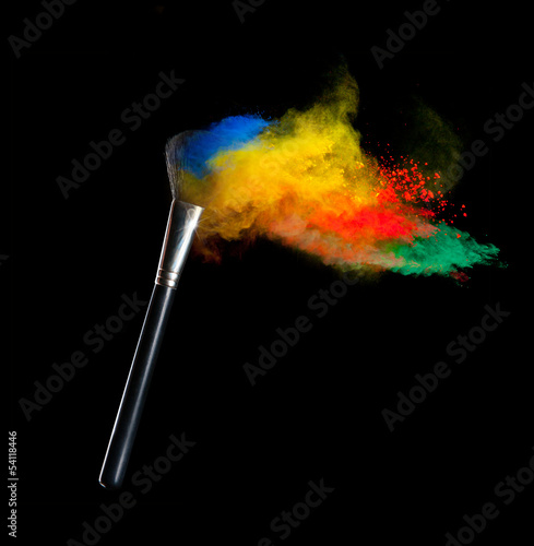 Colored powder with brush, isolated on black background