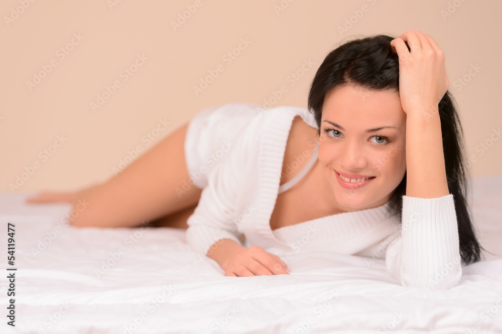 Beauty on sofa. Beautiful young woman lying on the sofa and look Beauty on sofa. Beautiful young woman lying on the sofa and look