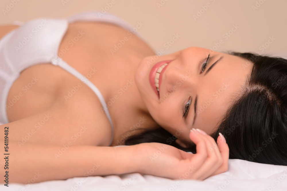 Obraz premium Beauty in bed. Beautiful young woman in lingerie lying on the so