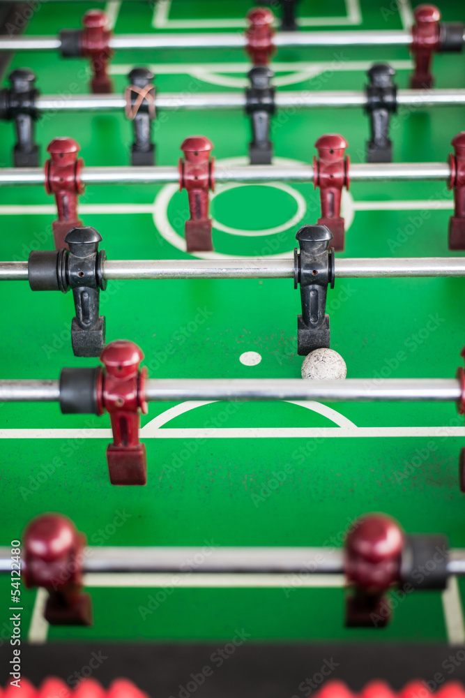 Close up of a foosball game with soccer ball. Close up of a foosball game with soccer ball.