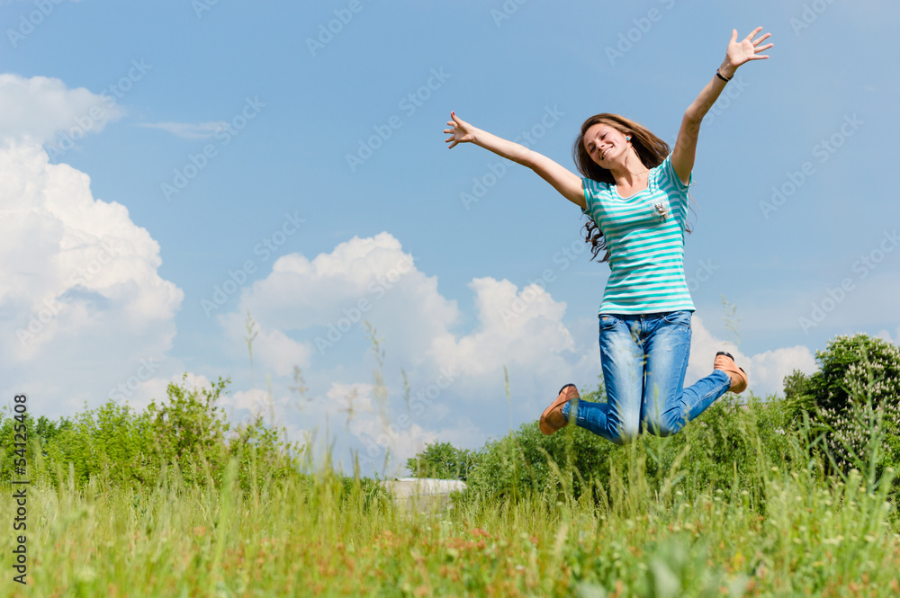 happy teenage girl jumping on the summer outdoors background happy teenage girl jumping on the summer outdoors background