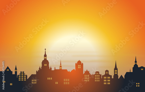 Eine Altstadtkulisse im Sonnenuntergang – Vektor