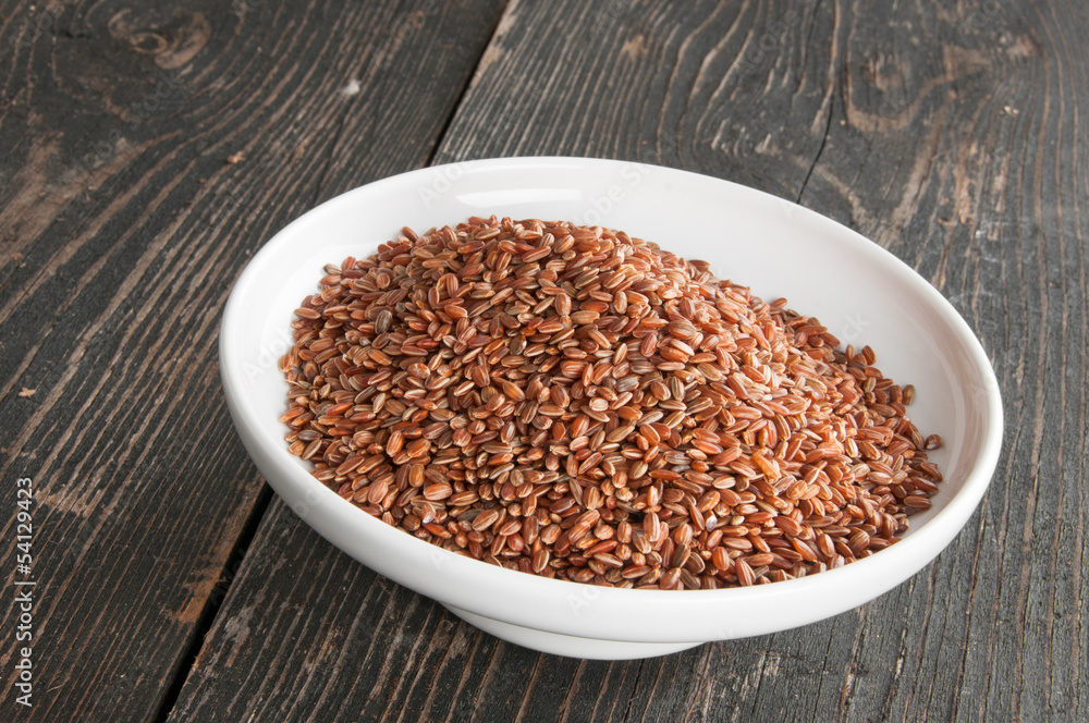 red rice in a bowl on the table red rice in a bowl on the table