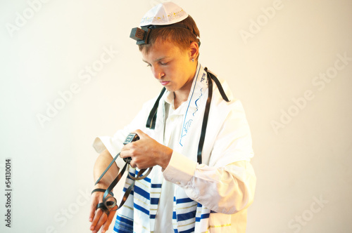 Young Jewish man does  prayers .