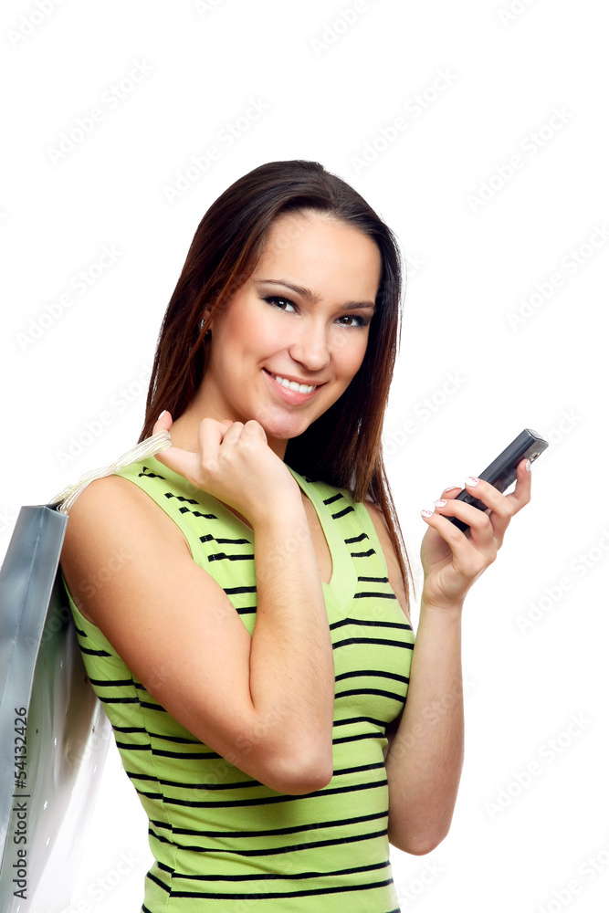 Girl calling by mobile phone with shopping bags. Isolated Girl calling by mobile phone with shopping bags. Isolated