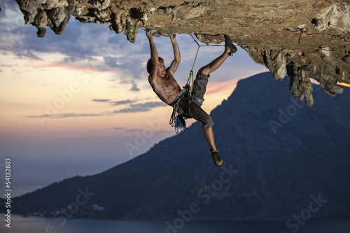 Rock climber at sunset, Kalymnos Island, Greece