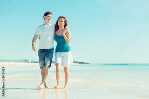 Young Couple Walking on a Caribbean Beach © william87