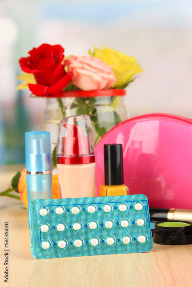 Hormonal pills in women's bedside table on room background Hormonal pills in women's bedside table on room background